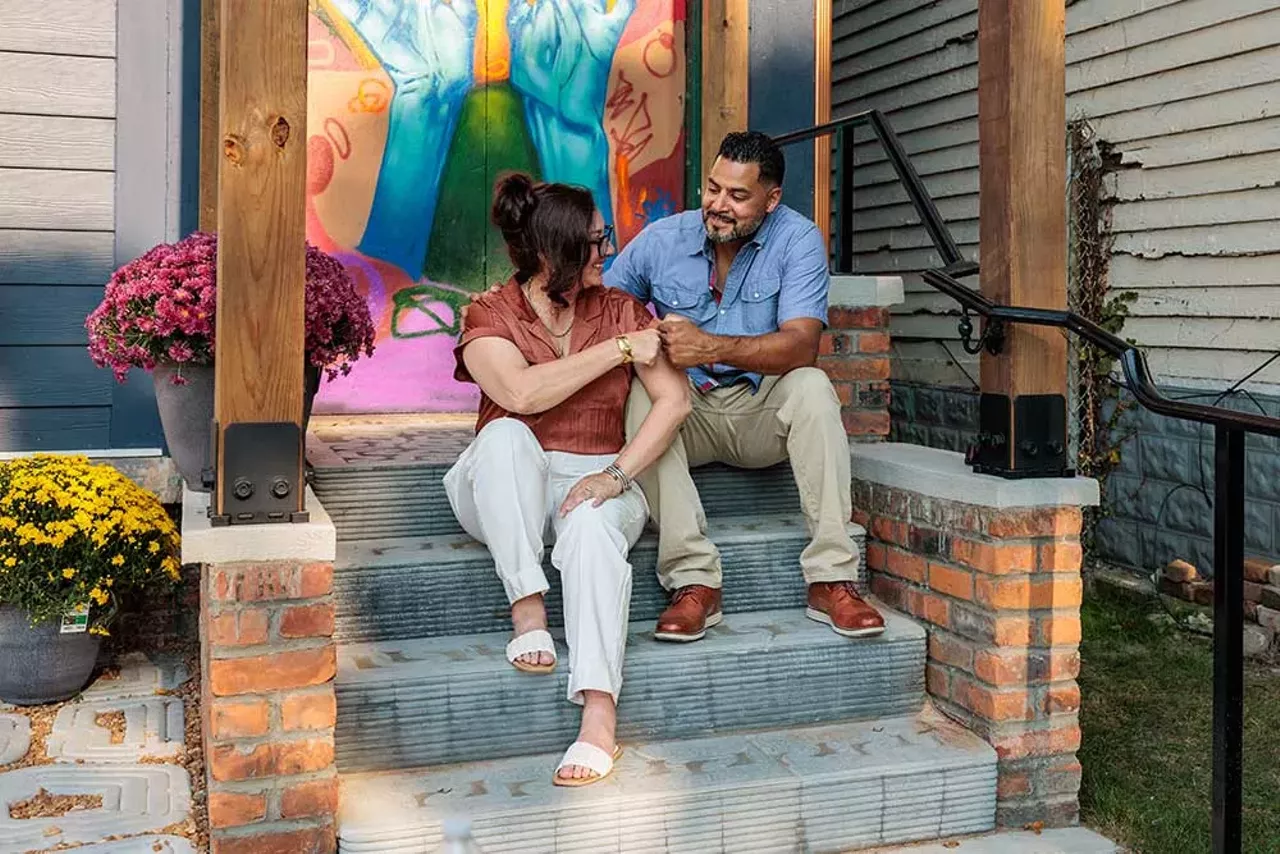 Tanya Saldivar-Ali and Luis Ali sit on the porch outside the Design Build Green Tech Hub during its September 14, 2024, grand opening.