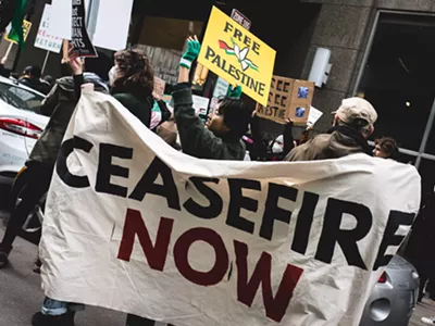 Protesters call for a ceasefire at Sen. Debbie Stabenow’s Detroit office.