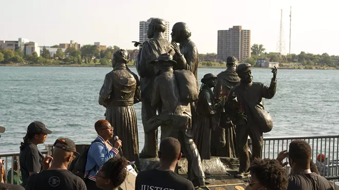 Black activists rally against racism next to an Underground Railroad monument in Hart Plaza in Detroit.