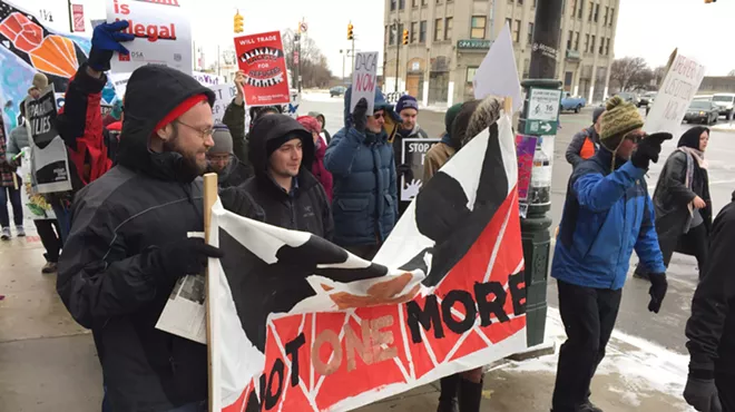 Demonstrators march from Roosevelt Park to the federal building in downtown Detroit to urge lawmakers to pass a "clean" Dream Act.