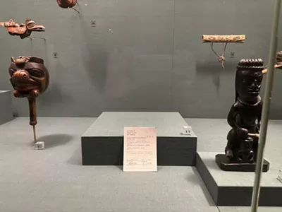 An item described as a “model of a Shaman’s guardian figure” from the Central Council of Tlingit & Haida Indian Tribes of Alaska had been removed from a display case at the DIA. A placard in its place notes “this item has been temporarily removed” and is dated August 1, 2022.