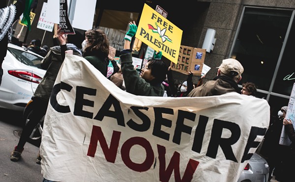 Protesters call for a ceasefire at Sen. Debbie Stabenow’s Detroit office.