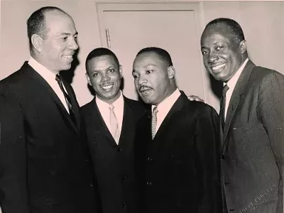 From Left: Mich. Supreme Court Justice Otis M. Smith, Damon J. Keith, Dr. Martin Luther King Jr. and Michigan Secretary of State Richard Austin, 1965. (WSU Press)