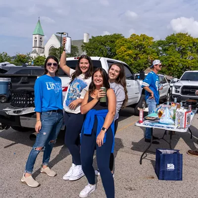 Image: Detroit Lions fans show team spirit at first home game of the season