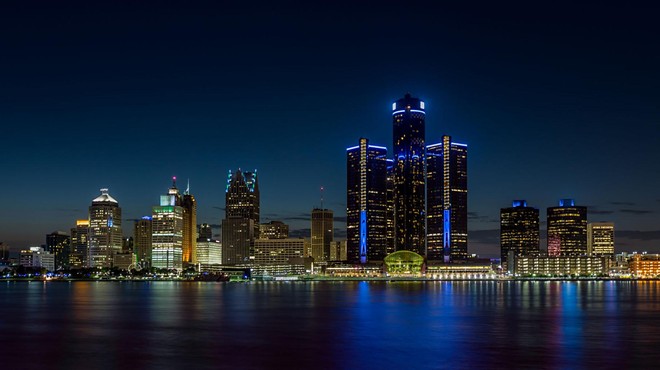 Detroit, Michigan skyline at night shot from Windsor, Ontario.