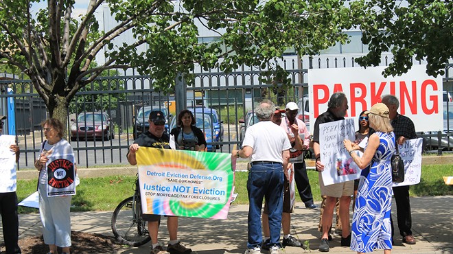 A group of Detroit residents and the Detroit Eviction Defense Coalition gathered in New Center on July 11, 2014 to protest against an Oakland County developer currently locked in a court case with those residents. (Ryan Felton / Metro Times)