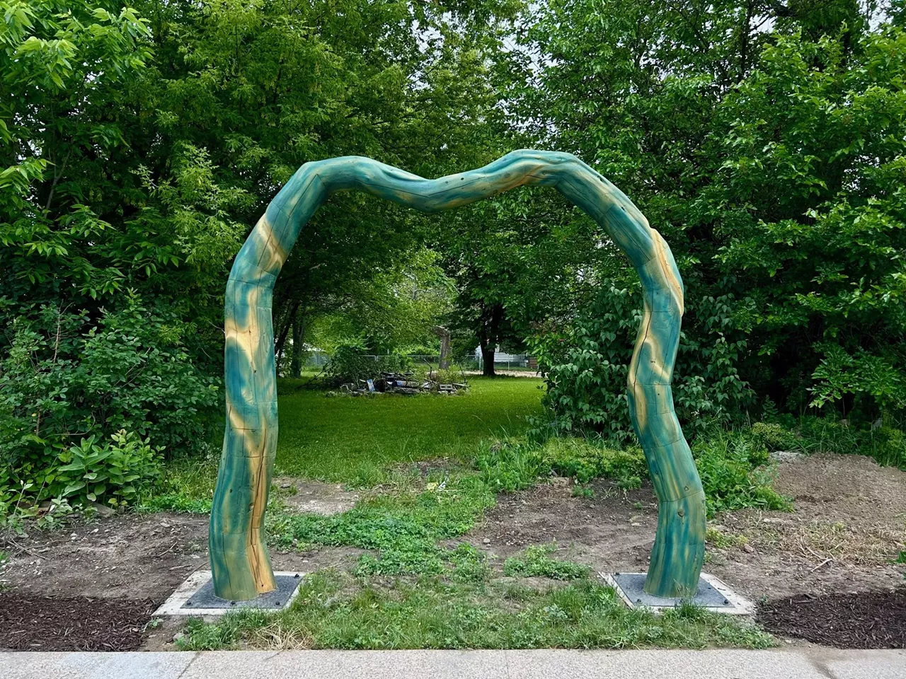 One of four artistic wood arbors installed at the North End Arts Alley.
