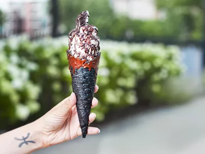 The Sweet Creem, with dark chocolate magic shell in a dark chocolate dipped gluten-free and vegan handmade waffle cone.