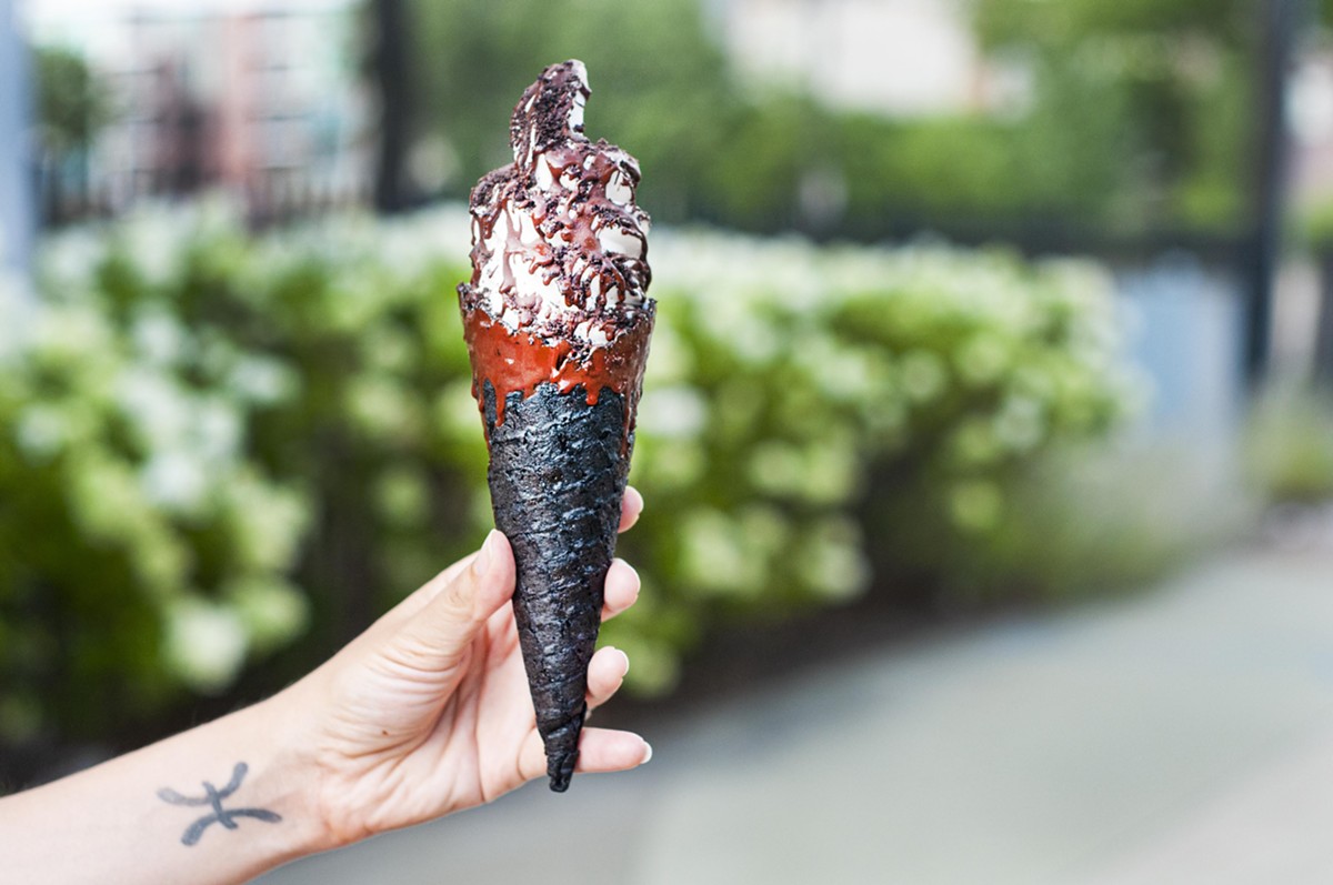 The Sweet Creem, with dark chocolate magic shell in a dark chocolate dipped gluten-free and vegan handmade waffle cone.