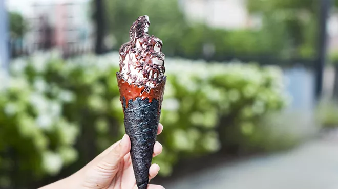 The Sweet Creem, with dark chocolate magic shell in a dark chocolate dipped gluten-free and vegan handmade waffle cone.