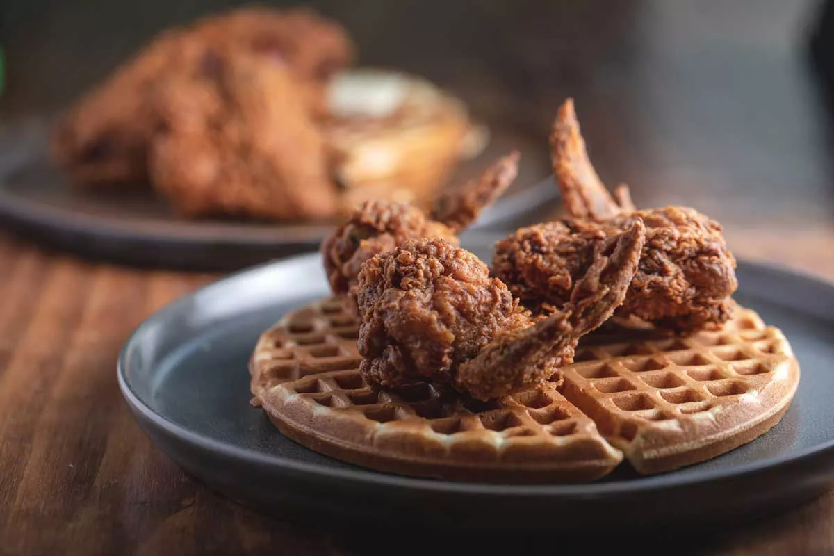 Image: The menu at Fixins Soul Kitchen includes soul food favorites like chicken and waffles.