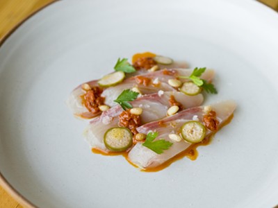Hamachi with calabrese chili, pine nut, and caperberries.