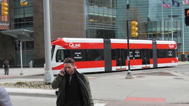 The QLine streetcar passes by in downtown Detroit.
