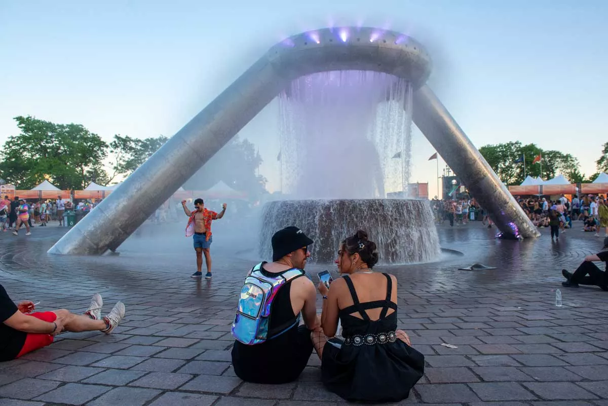 Image: Movement Music Festival fans enjoy the newly renovated Dodge and Son Memorial Fountain.