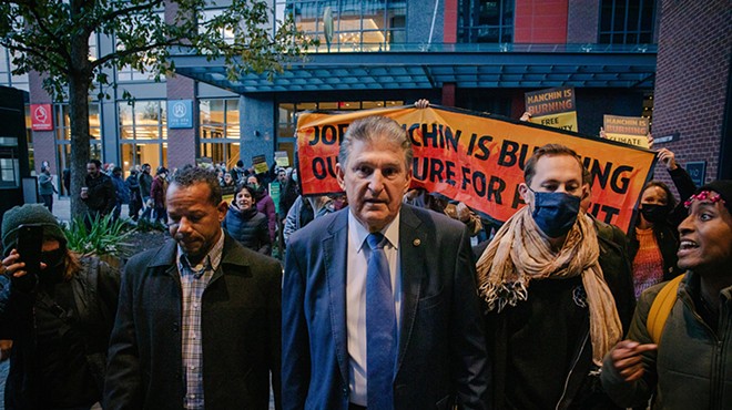 Sen. Joe Manchin confronted by climate activists in 2021. Perhaps they left an impression on him.