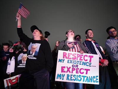 Supporters react as they listen to Donald Trump’s speech live on the radio outside of Drake Enterprises, an automotive supplier in Clinton Township in Macomb County.