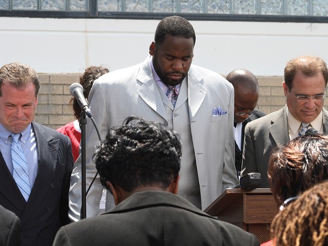 Kwame Kilpatrick and other officials at a public prayer rally.