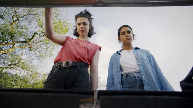 Margaret Qually and Geraldine Viswanathan eye the MacGuffin in the trunk.