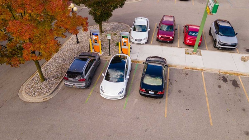Cars using a charging station in downtown Saginaw.