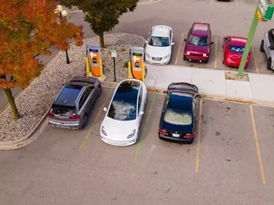 Cars using a charging station in downtown Saginaw.