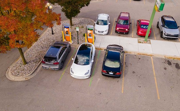 Cars using a charging station in downtown Saginaw.