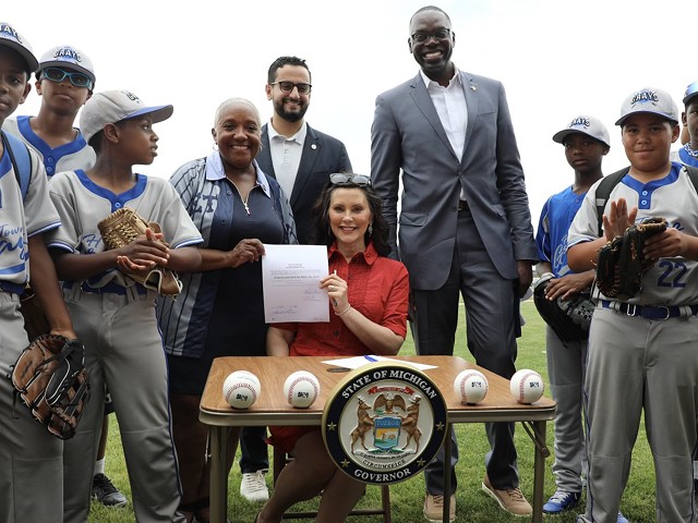 Gov. Gretchen Whitmer signs a bill at Historic Hamtramck Stadium recognizing May 2 as Negro Leagues Day in Michigan.
