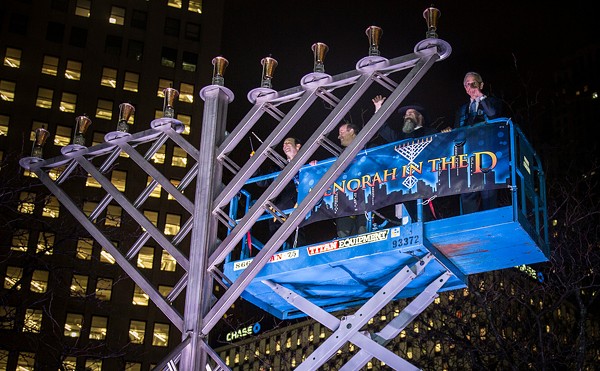 Rabbi Kasriel Shemtov, second from right, leads the Menorah in the D festivities.