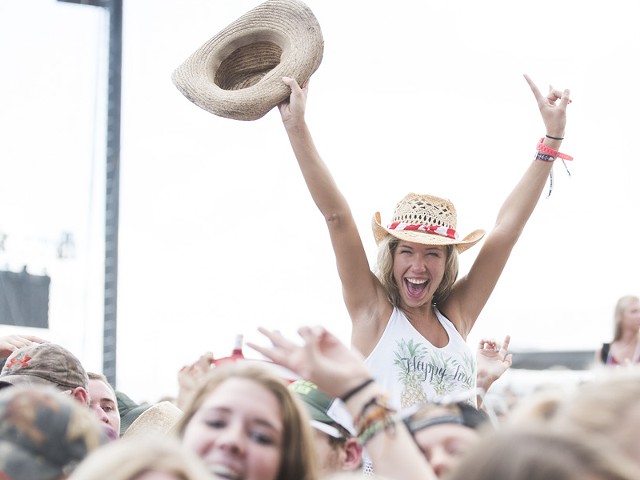 Country music fan Haley Nugent poses in a scene from Faster Horses festival in 2016.