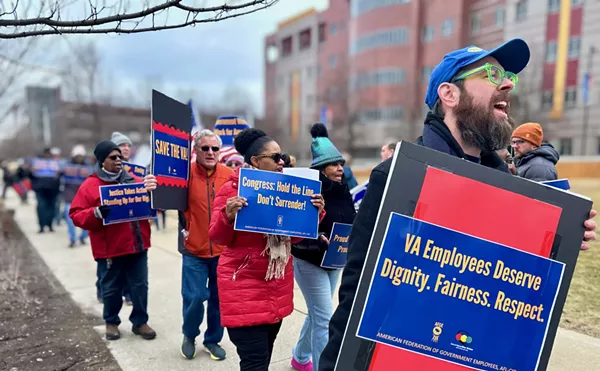 More than 100 federal workers and their allies turned out to protest cuts to veterans' services in Detroit.