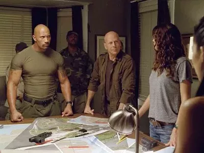 Dwayne Johnson (left) and Bruce Willis are held prisoner by the military-Hollywood complex.