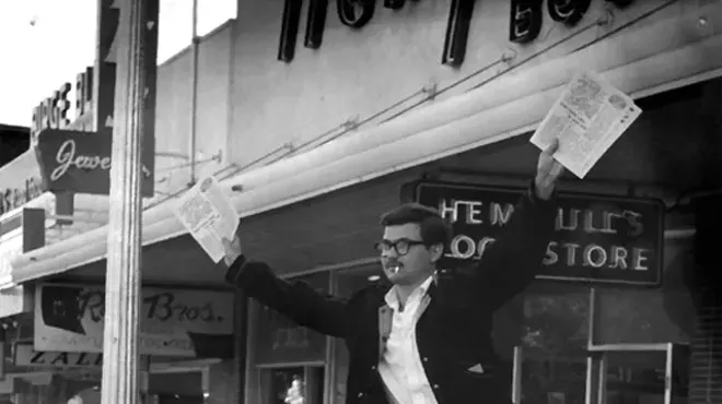 The late George Vizard and Mariann Vizard (now Mariann Wizard) hawking The Rag in Austin, Texas. The Rag was one of hundreds of underground papers.