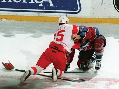 Red Wing Darren McCarty and Colorado Avalanche Claude Lemieux fight during first-period action at Joe Louis Arena.