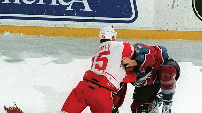 Red Wing Darren McCarty and Colorado Avalanche Claude Lemieux fight during first-period action at Joe Louis Arena.