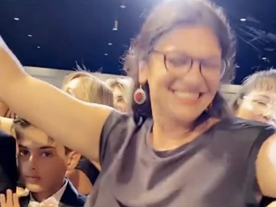 Rep. Rashida Tlaib dances without a mask at a wedding in Dearborn.