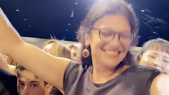 Rep. Rashida Tlaib dances without a mask at a wedding in Dearborn.