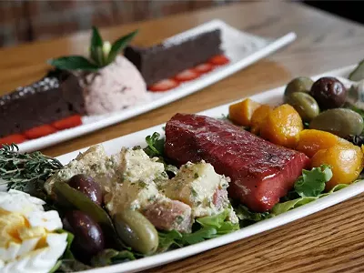 Beet-cured salmon nicoise, front, and &quot;Chocolate Decadence,&quot; back, from the Ravens Club in Ann Arbor.