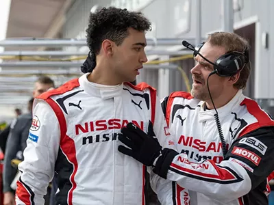 David Harbour (right) teaches Archie Madekwe how to take his talents from sim racing to the real deal.