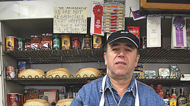 Vasile Sirca shows off his bakery's breads.