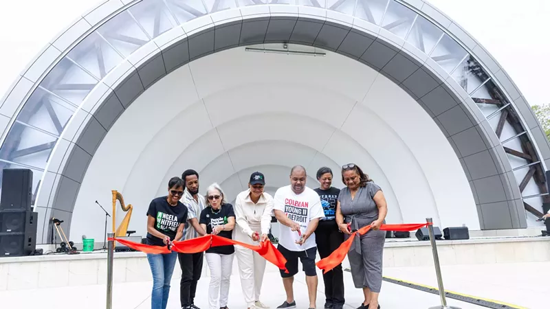 Dignitaries cut the ribbon for the Palmer Park Bandshell.