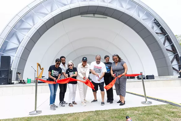 Dignitaries cut the ribbon for the Palmer Park Bandshell.