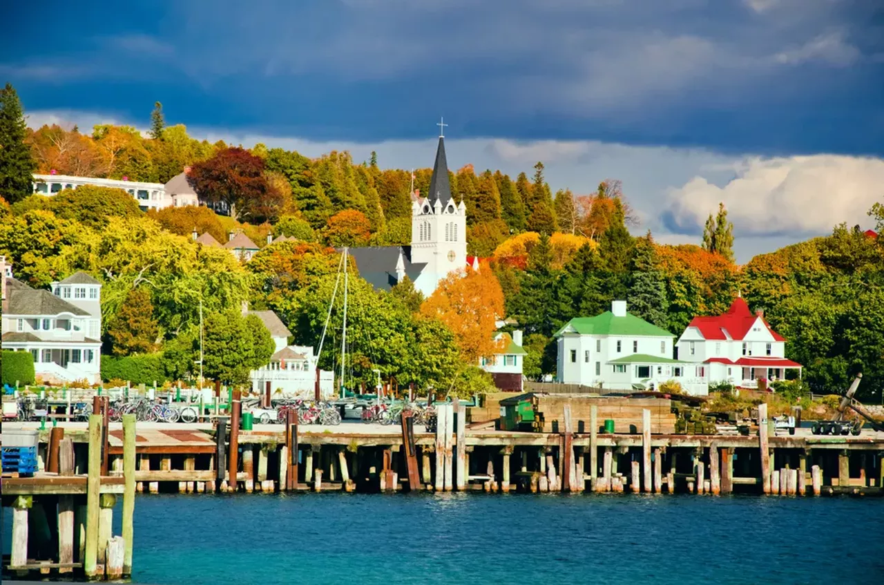 Mackinac Island Take the ferry to Mackinac island for a step back in time. There are no cars on the island, but you travel by horse and carriage or bike. You can take a leisurely ride, stopping to see rock formations like the Devil’s Kitchen and Arch Rock. Or take a nap by the shoreline, which we highly recommend.