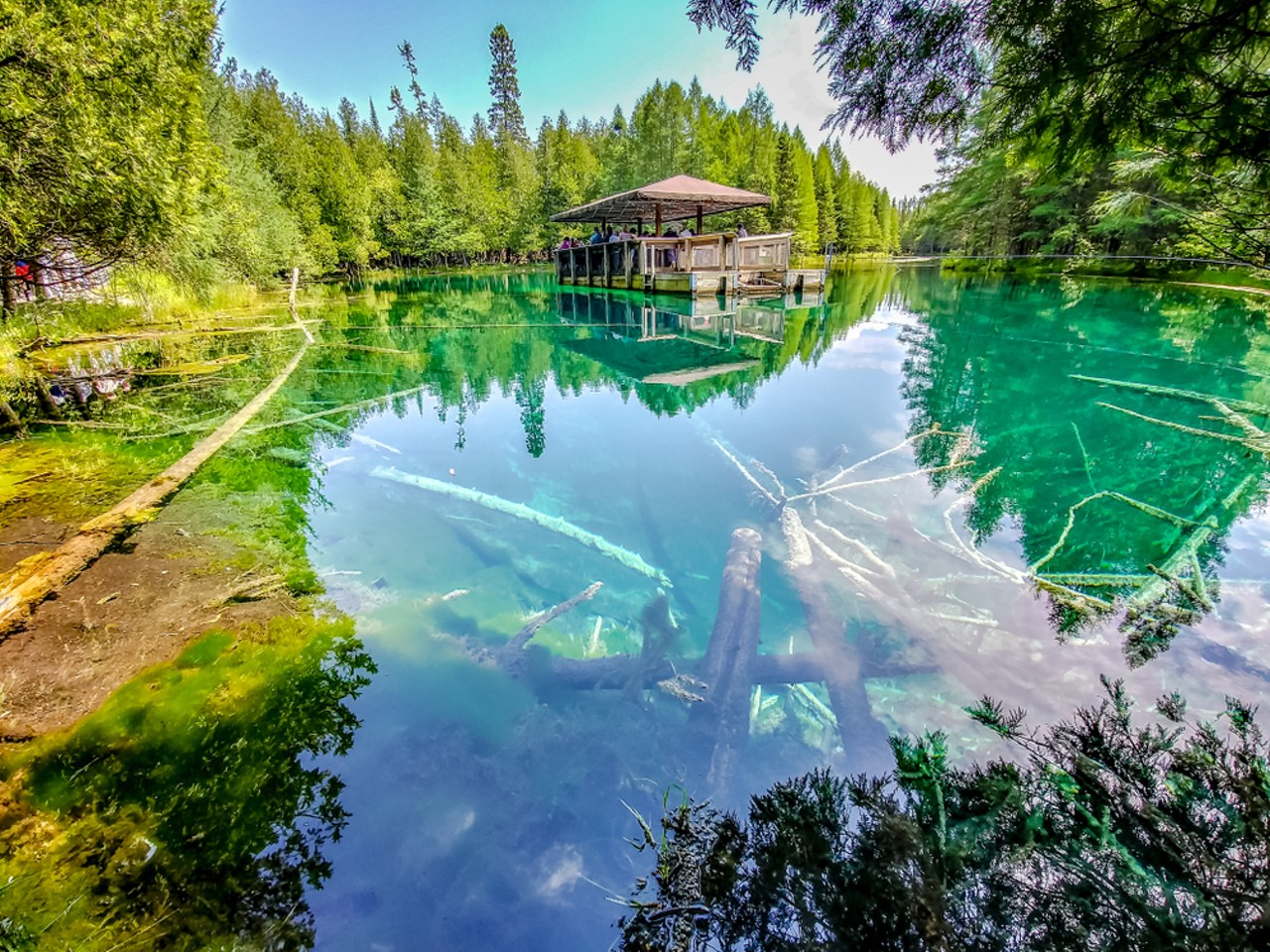 Kitch-iti-Kipi
“Michigan’s Big Spring” in Manistique may have the bluest water you’ll ever see. Take a raft out on the crystal clear water or just chill on the shore in complete awe. It’s even more scenic amongst the changing autumn leaves.