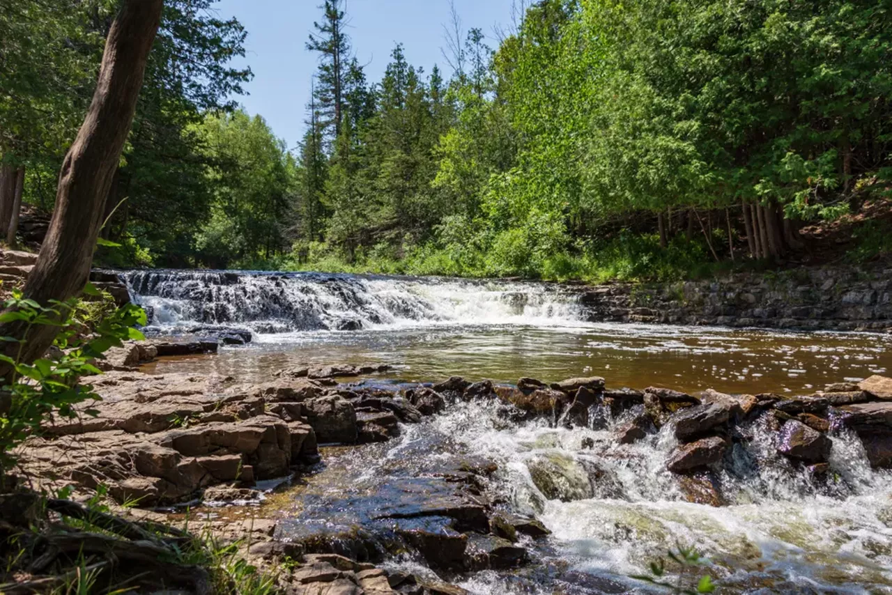 Ocqueoc Falls You don’t have to cross the Mackinac Bridge to see a waterfall in Michigan, though you will have to head up north. Located in Ocqueoc Township, near Cheboygan, Ocqueoc Falls is the largest waterfall in the Lower Peninsula. There’s a swimming hole and several dirt trails for hiking.