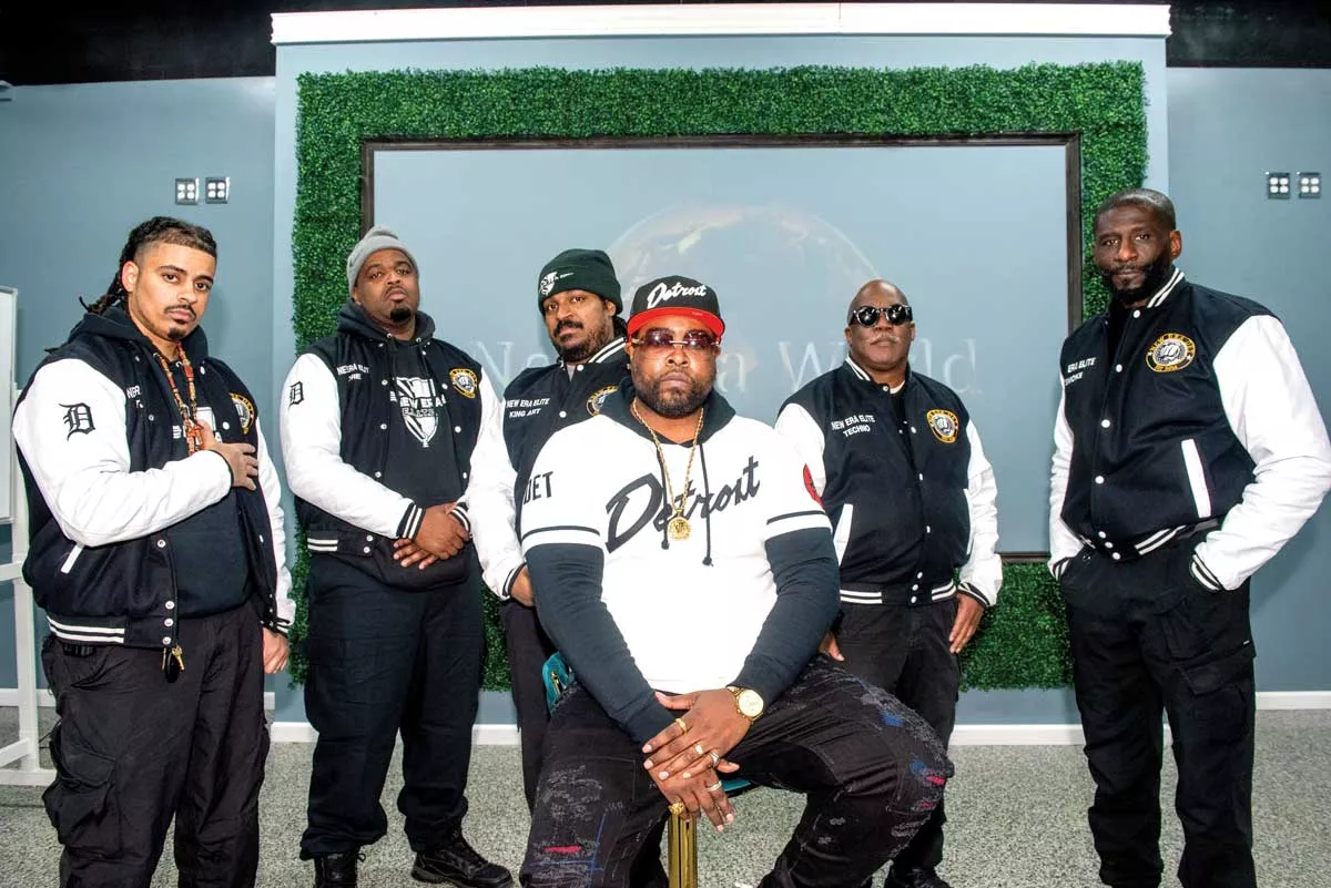 Image: New Era Detroit was founded by Isaiah “Zeek” Williams, center, to deter crime in Brightmoor.