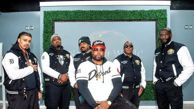 New Era Detroit was founded by Isaiah “Zeek” Williams, center, to deter crime in Brightmoor.