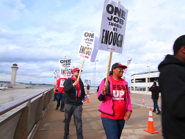 Shandolyn Lewis, center, and other union workers protesting at the Detroit Metropolitan-Wayne County Airport Terminal.
