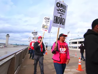 Shandolyn Lewis, center, and other union workers protesting at the Detroit Metropolitan-Wayne County Airport Terminal.