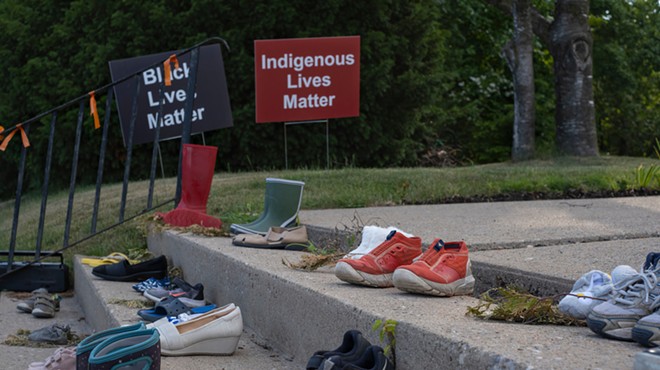 Shoes and toys at a memorial by a Catholic church in Toronto in tribute to 215 indigenous children whose remains were found in a school in Kamloops, British Columbia.
