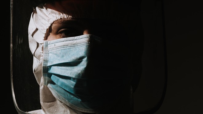 A doctor wearing a mask to protect against COVID-10.