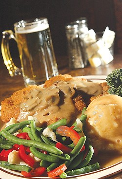 Jager Schnitzel: Breaded pork cutlet with mushroom sauce and vegetables. - MT PHOTO: ROB WIDDIS